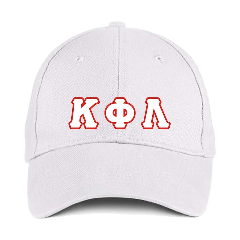May include: White baseball cap with the Greek letters &Kappa;&Phi;&Lambda; in red, outlined in white. The cap has a curved brim and a button on top. This hat is a classic accessory.