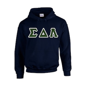 May include: Navy blue hooded sweatshirt with a front pocket. The sweatshirt features the Greek letters ΣΔΛ in a green and white design. The Gildan brand logo is visible on the inside of the hood.
