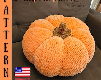 May include: A plush, orange pumpkin pillow with a textured surface and a brown stem. The pillow is handmade and has the text "Pumpkin pillow" and "Sylvee's Crochet". The image also includes the American flag and the Hungarian flag.