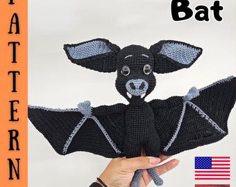 May include: Crochet pattern for a black bat with grey ears and wings. The pattern is available in English and Hungarian. The pattern is for a crocheted toy.
