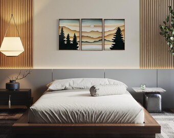 May include: A minimalist bedroom with a wooden platform bed, white bedding, and a three-piece art print depicting a mountain landscape with a sunset.