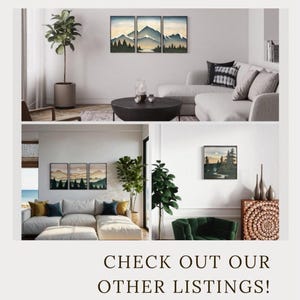May include: Three framed landscape paintings with a mountain scene in shades of blue, green, and brown. The paintings are hung on a white wall above a white couch. The couch is in a living room setting with a coffee table and a potted plant.