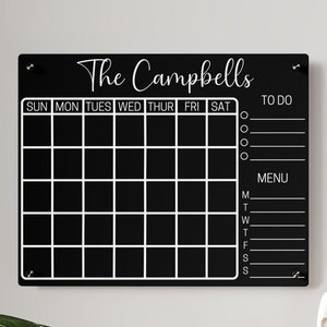 May include: Black chalkboard with white lettering for a weekly calendar, to-do list, and menu. The chalkboard has the text "The Campbells" at the top.