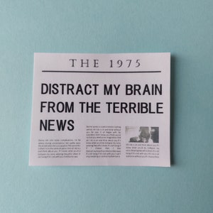 The 1975 newspaper sticker