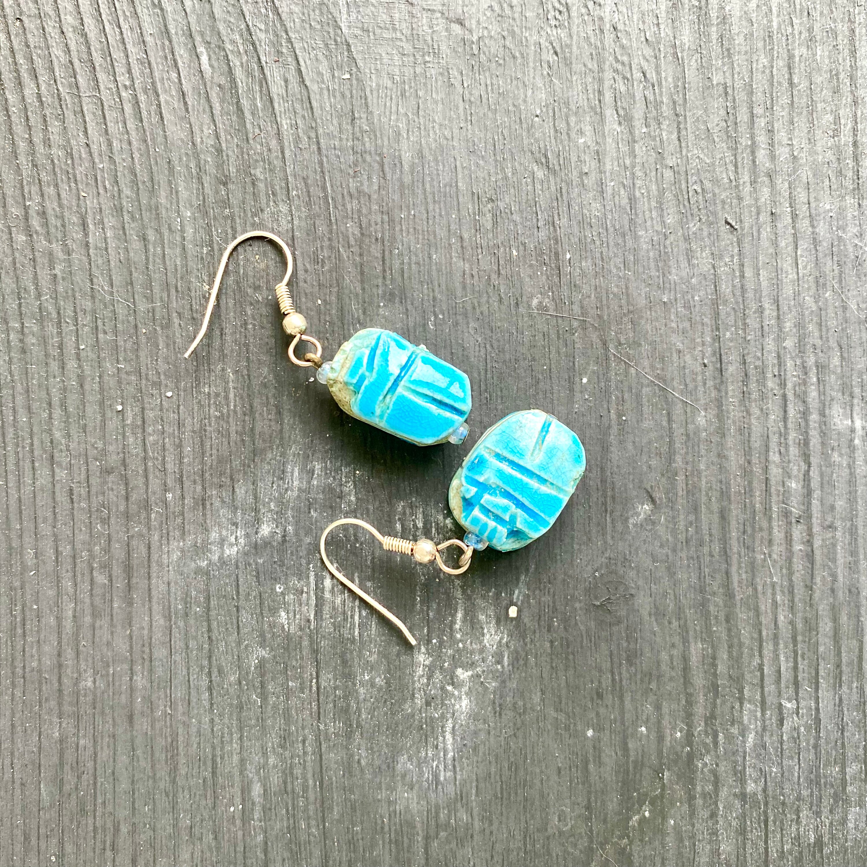 Blue scarab shop earrings