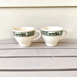 2 Currier & Ives Stagecoach Teacups, Vintage Ceramic Restaurant Ware Flat Bottom Tea Cups By Sico, Beige W/Green Stripe, Retro Western Decor