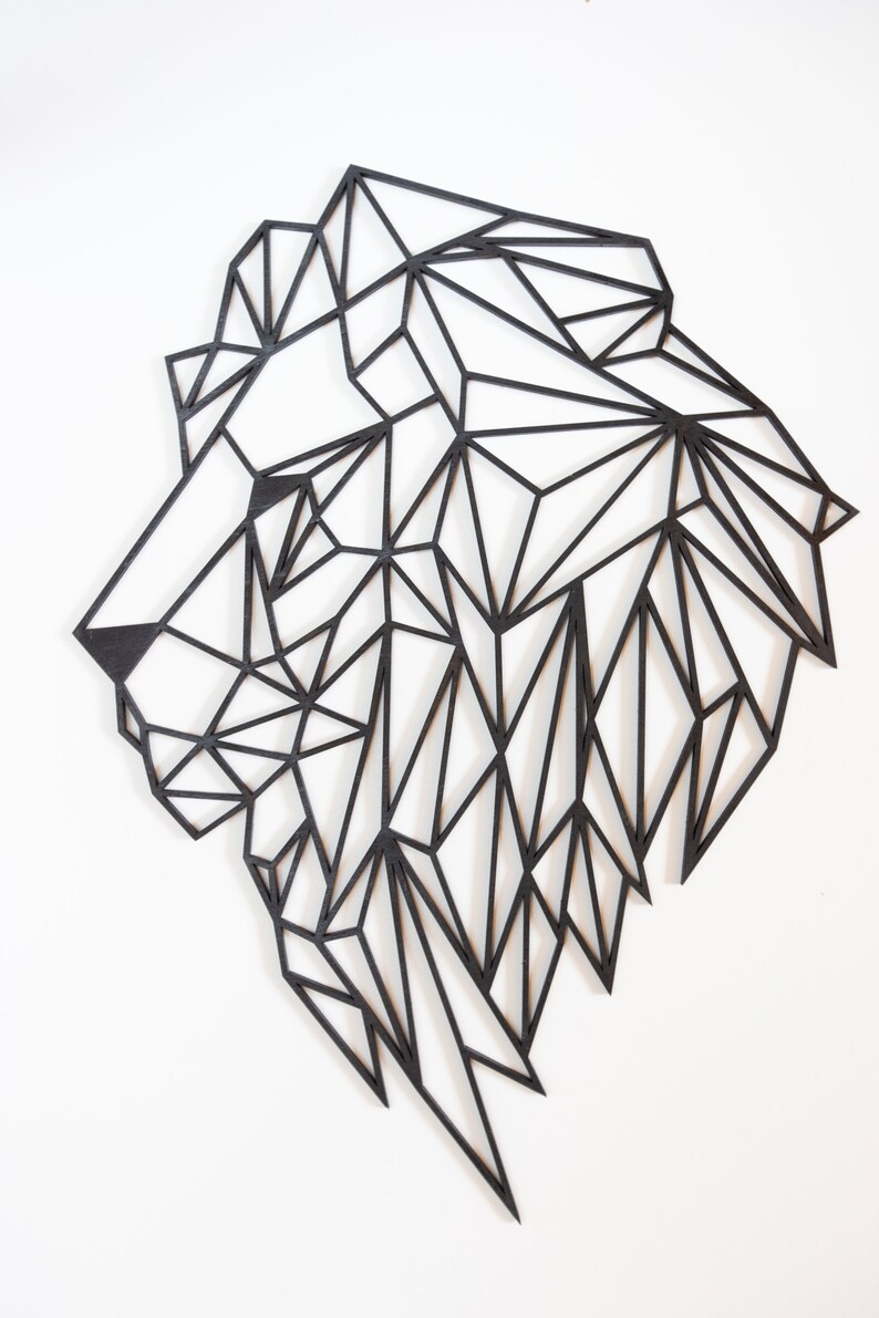May include: Black geometric lion head wall art made of wood. The lion's head is made up of many triangles and is in a profile view.