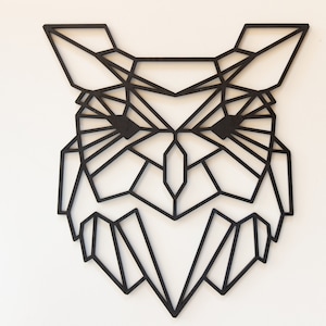 May include: Black geometric owl wall art made of wood. The owl is designed in a modern, minimalist style with a geometric pattern.