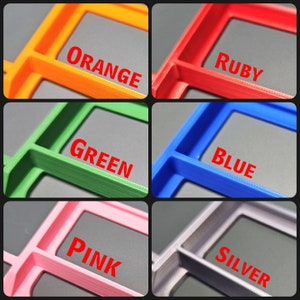 May include: Six plastic storage containers with different colored lids: orange, red, green, blue, pink, and gray. Each container has a label with the color name printed in red.