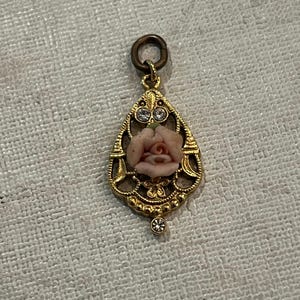 Vintage porcelain style rose and rhinestone gold tone pendant. Very sweet!