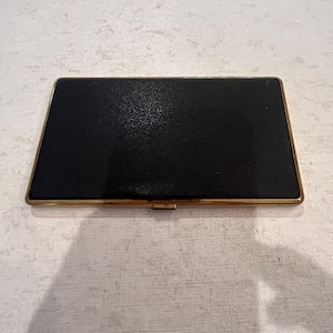 Vintage black faux leather and gold metal cigarette hard case. GUC!