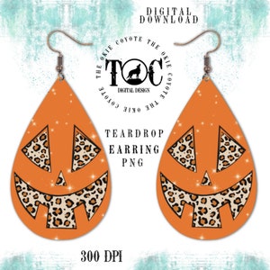 May include: A pair of orange teardrop-shaped earrings with a leopard print jack-o'-lantern design. The earrings are 300 DPI.