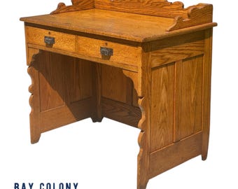 Antique Victorian Tiger Oak Raised Panel Two Drawer Desk with Scrolled Gallery