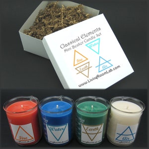 May include: A set of four mini beaker candles representing the classical elements: fire, earth, water, and air. Each candle is a different colour and has a symbol representing its element on the label. The candles are packaged in a white box with the words "Classical Elements Mini Beaker Candle Set" printed on it.