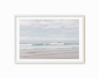 Beach photography wall art Framed Print, Canvas or Print - a pale blue beach with rolling waves and fluffy white summer clouds