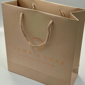 Luxury paper gift bags with embossed gold foil custom printing Bespoke retail bags custom paper bags with ribbon closures Luxury paper bags