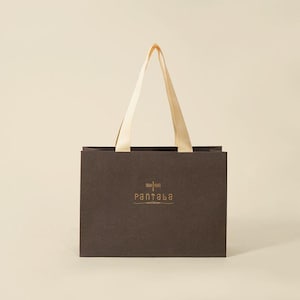 Gift bag for retail paper bags with custom printing Bespoke paper bags with ribbon tie closures Luxury matte paper bags gift bag