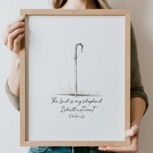 Puede incluir: Una ilustración en blanco y negro de un cayado de pastor con el texto "The Lord is my shepherd I shall not want Psalm 23:1" impreso debajo.