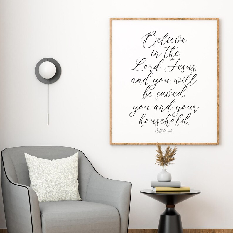 May include: A framed print with a white background and black text. The text reads "Believe in the Lord Jesus, and you will be saved. You and your household."  Acts 16:31