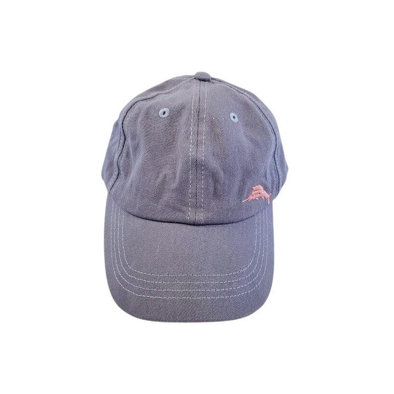 May include: A gray baseball cap with a curved brim and a small, pink embroidered logo on the side. The cap has a six-panel design with a button on top and white stitching details. The hat is made of a soft, durable fabric.
