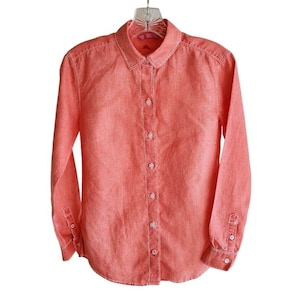 May include: A long-sleeved, coral linen button-down shirt with a classic collar and a button-up front.