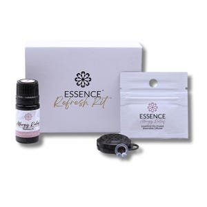 May include: A white box with the text "ESSENCE Refresh Kit" on the front. The box contains a small bottle of essential oil labelled "Allergy Relief", a small white pouch with the text "ESSENCE Allergy Relief Essential Oil-Infused Wearable Diffuser", and a black wearable diffuser.