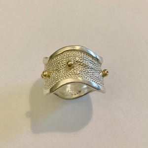 Anello in argento e oro giallo 18kt