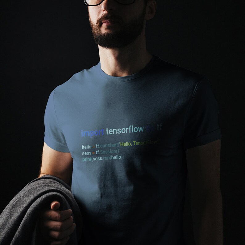 May include: A blue t-shirt featuring the text "import tensorflow as tf" and code in various colours. The code includes the lines "hello = tf.constant('Hello, TensorFlow')", "sess = tf.Session()", and "print(sess.run(hello)".