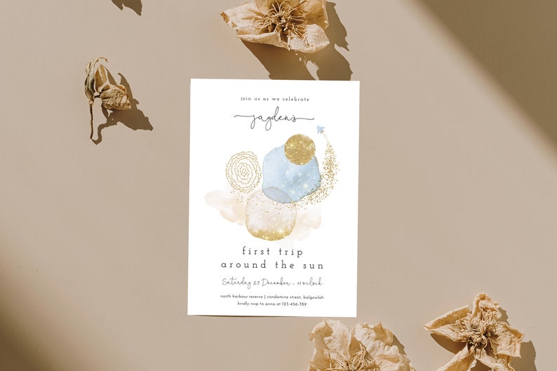 May include: A blue and gold watercolor invitation with the text "Join us as we celebrate Jayden's first trip around the sun. Saturday 23 December - 5:00 pm. North Harbour Reserve | Coronation Street, Balgowlah. Kindly RSVP to Anna at 123 456 7890."