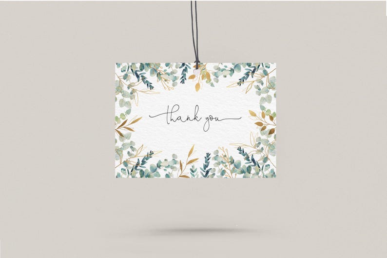 May include: A white card with a watercolour border of green and gold leaves. The card says "Thank you" in black cursive.