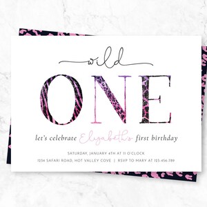 May include: A white invitation card with the words "wild ONE" in large, stylized letters. The "O" has a zebra print, and the "NE" has a leopard print. The text "let's celebrate Elizabeth's first birthday" is also included.