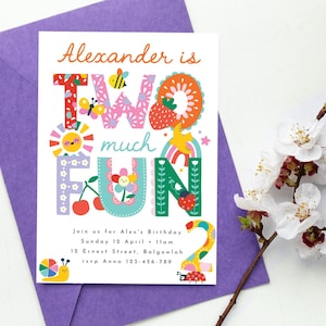 May include: A colorful birthday invitation with the text "Alexander is TWO much FUN." The design includes illustrations of a sun, cherries, a rainbow, and a ladybug. The invitation is on a white card, set on a purple envelope, with white flowers.