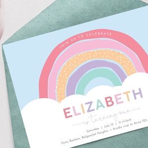 May include: A rainbow-themed birthday party invitation for Elizabeth, who is turning one. The invitation features a colorful rainbow with white clouds and the text "JOIN US TO CELEBRATE ELIZABETH is turning one" in a whimsical font. The invitation also includes the date, time, and location of the party, as well as contact information for RSVP.