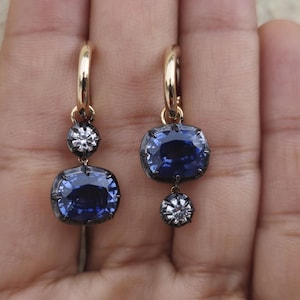 Women 4 stone asymmetric earrings, elongated cushion lab blue sapphire and cushion moissanite set in Georgian cut down button back setting.