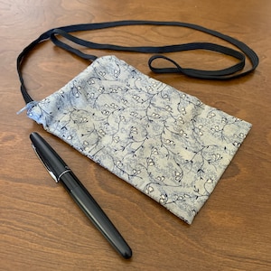 Beautiful crossbody zippered pouch for your phone, passport, wallet, glasses, cash, etc.
