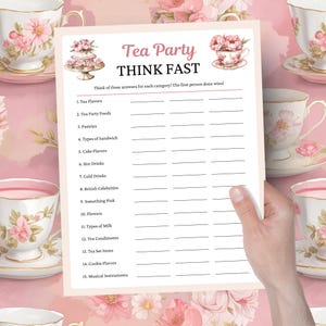 May include: A pink and white tea party game sheet with the text "Tea Party THINK FAST". The game sheet includes categories such as tea flavors, pastries, and British celebrities. The sheet is held by a person.