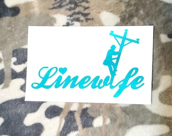 Linewife with lineman on pole