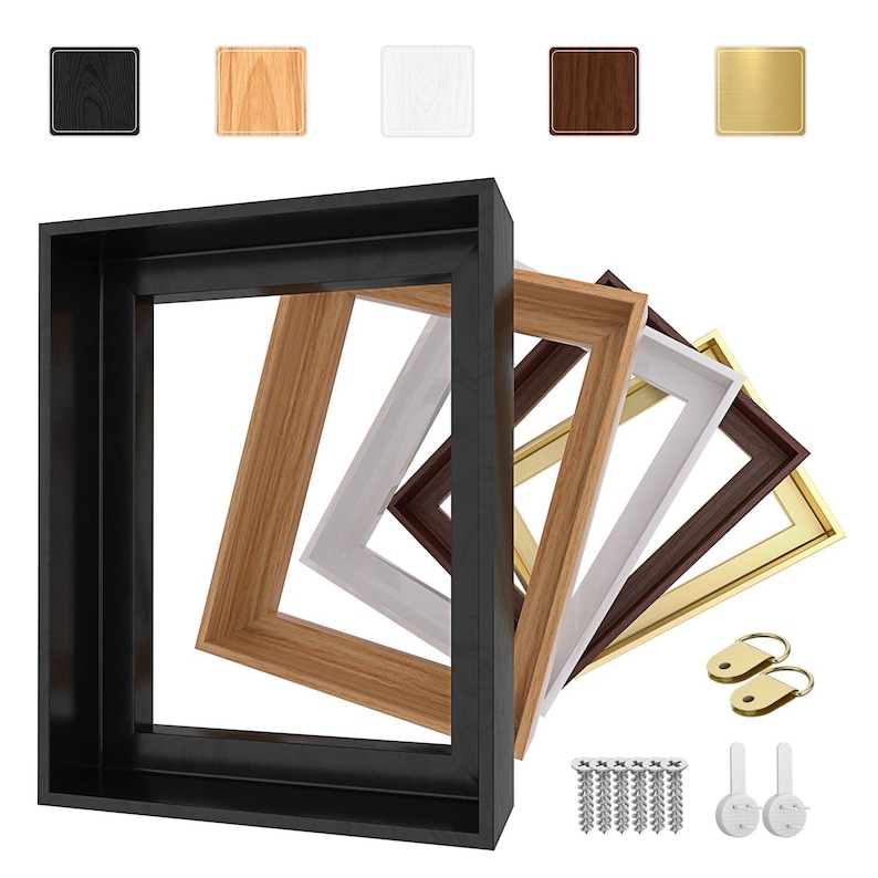 May include: A collection of wooden picture frames in various colors, including black, natural wood, white, dark brown, and gold. The frames are square and rectangular, with hardware and hanging hooks visible.
