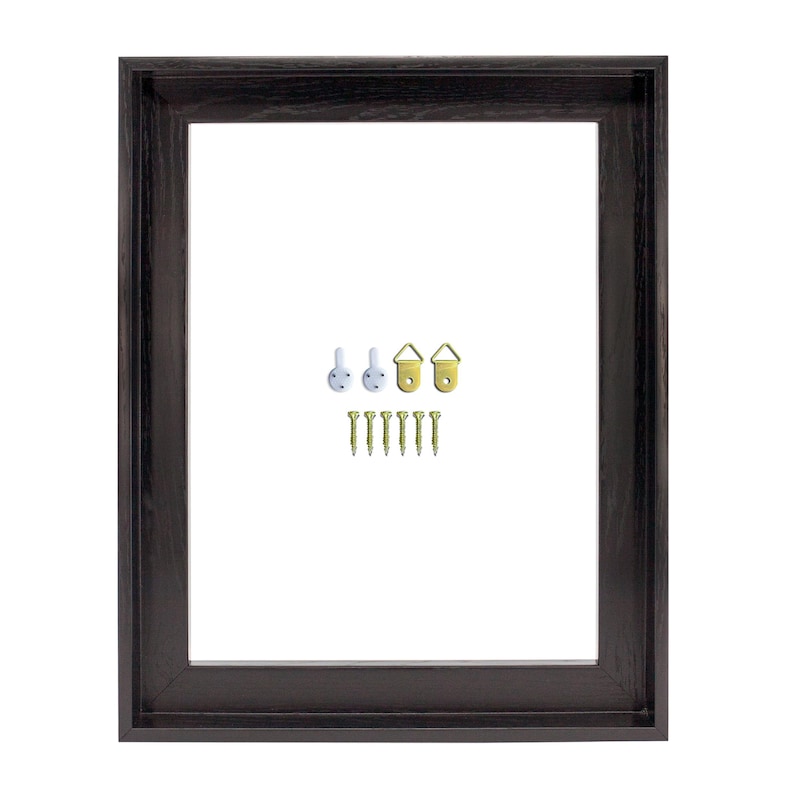 May include: A dark brown wooden picture frame with a rectangular opening. Includes hanging hardware: white hooks, gold-colored sawtooth hangers, and small gold screws. The frame has a simple, classic design.