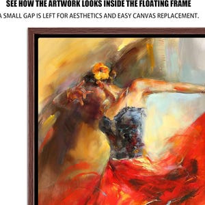May include: A framed artwork depicting a dancer in a red dress, with a black bodice and a flower in their hair. The painting has a warm color palette with yellow, orange, and red hues. The text at the top reads: SEE HOW THE ARTWORK LOOKS INSIDE THE FLOATING FRAME.