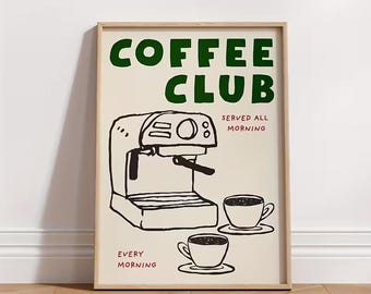 May include: A framed art print with a coffee theme. The words "COFFEE CLUB" are in green, above a black and white illustration of a coffee machine and two cups. The text "SERVED ALL MORNING" and "EVERY MORNING" are in red.