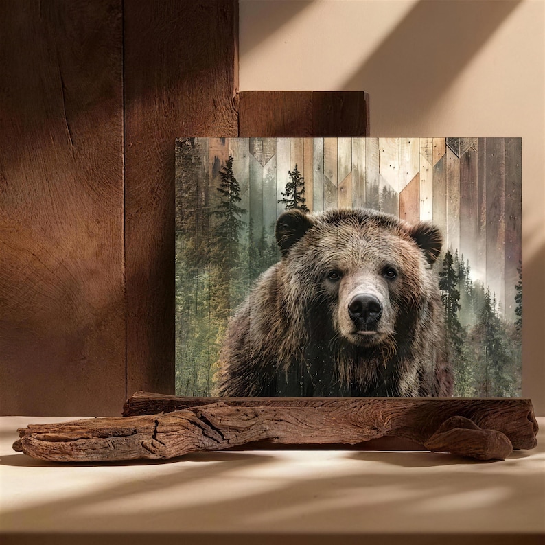May include: A framed art print featuring a close-up of a grizzly bear. The bear has brown fur and is set against a backdrop of a forest and wooden planks. The artwork is displayed on a wooden stand.