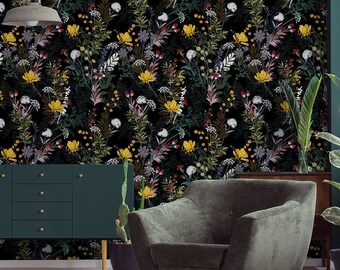 May include: A living room interior with a dark green sofa, a green armchair, and a gold-toned coffee table. The wall is covered in a floral wallpaper with a black background and yellow, white, and pink flowers.