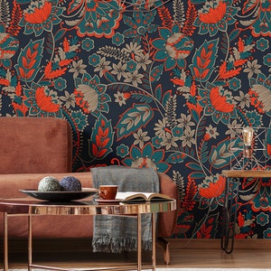 May include: A living room interior with a brown couch and a coffee table. The wall is covered in a teal and orange floral wallpaper.