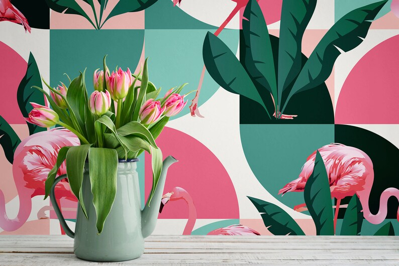 May include: A green ceramic pitcher filled with pink tulips sits in front of a wallpaper with a geometric pattern of pink and green circles and leaves. The wallpaper features pink flamingos.