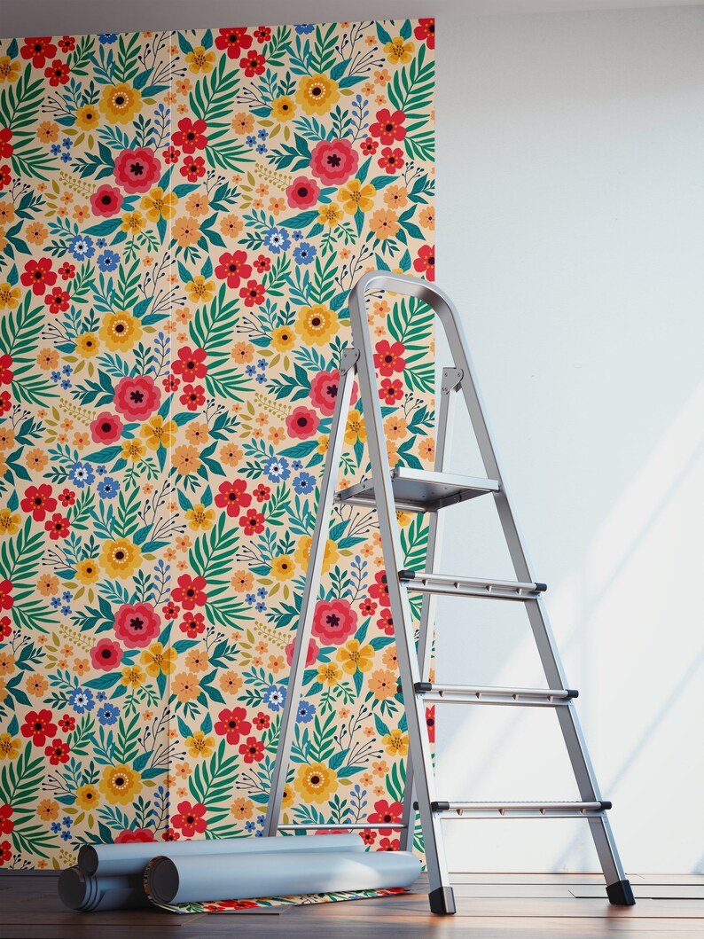 May include: A roll of floral wallpaper with a colorful pattern of red, yellow, blue, and green flowers on a cream background. A silver step ladder is next to the wallpaper roll.