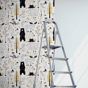 May include: A white wallpaper roll with a repeating pattern of black and yellow woodland animals, including bears, deer, owls, squirrels, and foxes. The wallpaper is being applied to a wall with a ladder.
