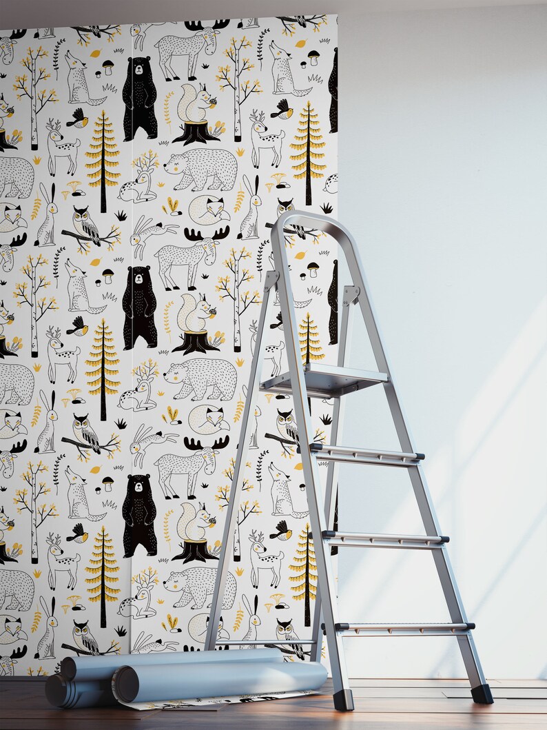 May include: A white wallpaper roll with a repeating pattern of black and yellow woodland animals, including bears, deer, owls, squirrels, and foxes. The wallpaper is being applied to a wall with a ladder.