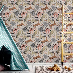 May include: A light blue teepee tent with white polka dots sits in front of a wall with a whimsical wallpaper featuring a repeating pattern of cats, fish, and other animal illustrations in shades of gray, brown, pink, and yellow.