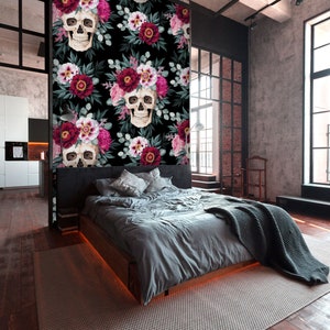 May include: A black and white floral wallpaper with a repeating pattern of skulls and flowers. The flowers are pink, red, and white. The skulls are white with black eyes and a black nose.